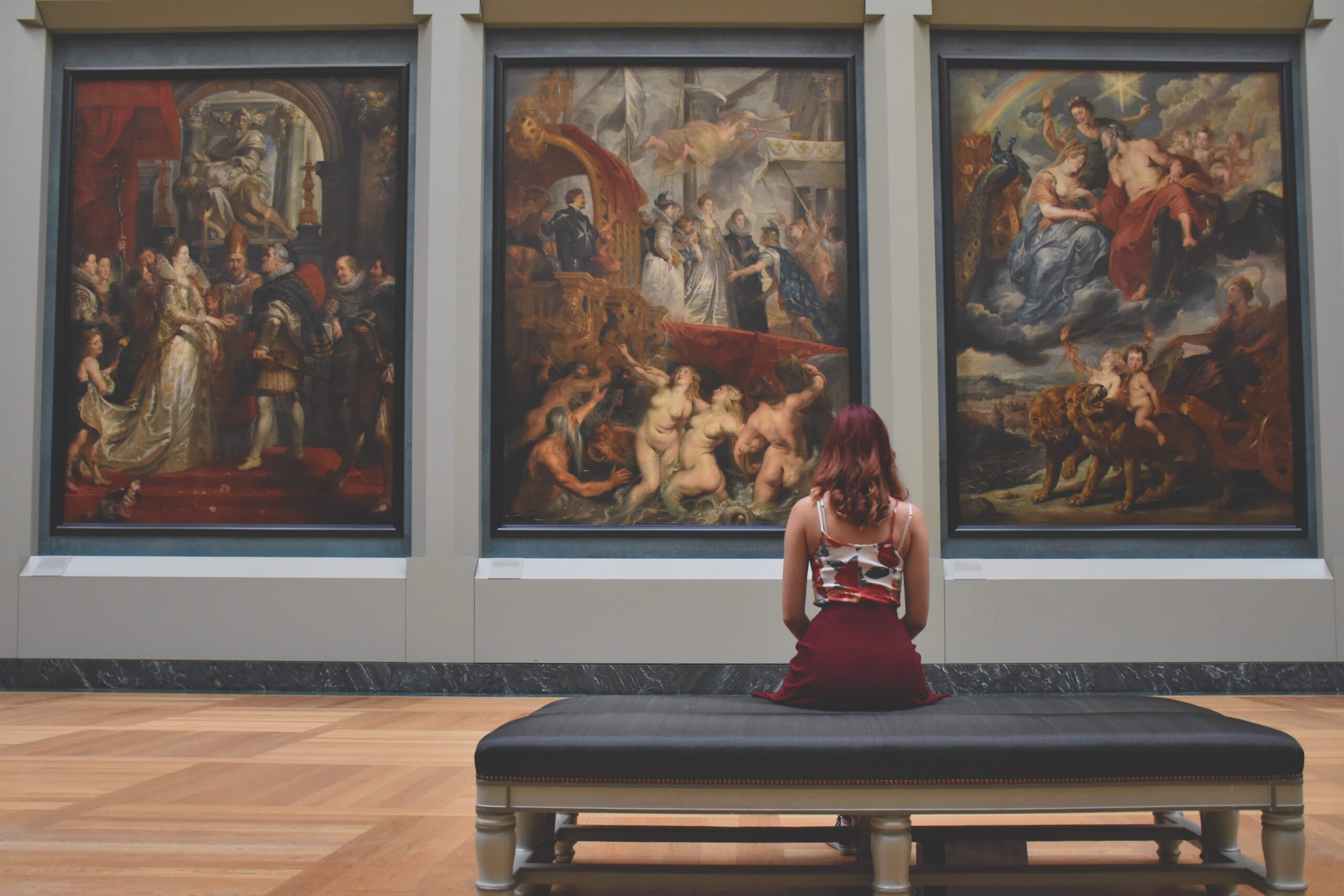 woman looking at painting